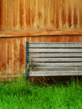 Faded Wooden Bench, Fence, And Grass Stock Photos