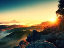 Fall morning mist. The sandstone cliff above treetops of forest royalty free stock photography Fall morning mist. The sandstone cliff above treetops of forest royalty free stock photography