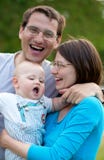 Famille de trois heureuse photos stock Famille de trois heureuse photos stock