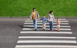 Family And Crossing Road, Green Fence And Grass Royalty Free Stock Photography