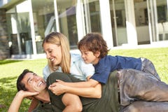 Family with child in the garden from the house royalty free stock photos Family with child in the garden from the house royalty free stock photos