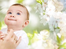 Close up of sweet little baby with mother hand stock photos Close up of sweet little baby with mother hand stock photos