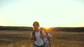 Family with children travels on the plains and mountains. father, mother daughter tourists. teamwork travelers. man stock video footage Family with children travels on the plains and mountains. father, mother daughter tourists. teamwork travelers. man stock video footage