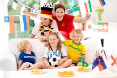 Fans watch football game. Family watching soccer. royalty free stock photos Fans watch football game. Family watching soccer. royalty free stock photos