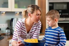 Family cooking in kitchen stock photos Family cooking in kitchen stock photos