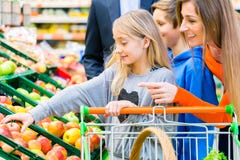 Family grocery shopping in hypermarket Stock Image Family grocery shopping in hypermarket Stock Image