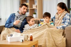 Family with ill children having fever at home stock photography Family with ill children having fever at home stock photography
