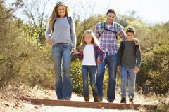 Family Hiking In Countryside Wearing Backpacks royalty free stock photography Family Hiking In Countryside Wearing Backpacks royalty free stock photography