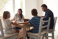 Family At Home In Eating Meal Together stock images Family At Home In Eating Meal Together stock images