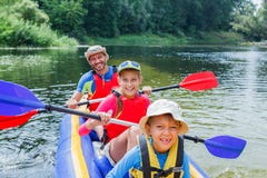 Family Kayaking On The River Royalty Free Stock Images