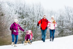 Family with kids having winter walk in snow stock photos Family with kids having winter walk in snow stock photos