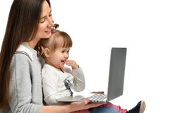 Family mother and child daughter at home with a laptop royalty free stock photos Family mother and child daughter at home with a laptop royalty free stock photos