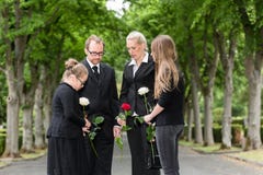 Family mourning on funeral at cemetery stock images Family mourning on funeral at cemetery stock images