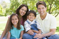 family outdoors sitting smiling family outdoors sitting smiling