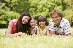 family outdoors smiling family outdoors smiling