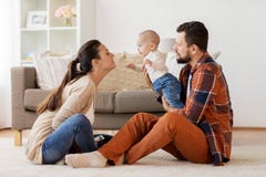 Happy family with baby having fun at home