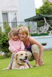 Family Plays With A Dog Stock Photos Family Plays With A Dog Stock Photos