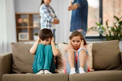 Sad children and parents quarreling at home royalty free stock photography Sad children and parents quarreling at home royalty free stock photography