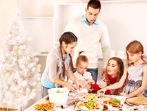 Family rolling dough in Xmas kitchen. stock photography Family rolling dough in Xmas kitchen. stock photography