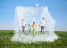 Family running on grass and dream house stock photo Family running on grass and dream house stock photo