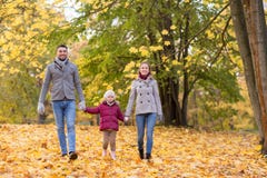 Happy family walking at autumn park stock photography Happy family walking at autumn park stock photography