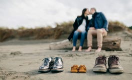 shoes kissing sand couple