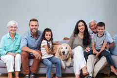 Family sitting on sofa with dog stock photos Family sitting on sofa with dog stock photos