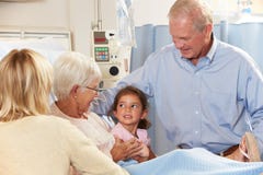 Family Visiting Senior Female Patient In Hospital Bed royalty free stock photo Family Visiting Senior Female Patient In Hospital Bed royalty free stock photo