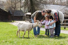 Family With Goat Stock Image