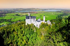 Famous Neuschwanstein Castle, 19th-century Romanesque Revival palace on a rugged hill above the village of Hohenschwangau in south royalty free stock images Famous Neuschwanstein Castle, 19th-century Romanesque Revival palace on a rugged hill above the village of Hohenschwangau in south royalty free stock images