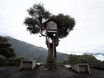 Famous swing at the end of the world at Casa del Arbol tree house near Banos Tungurahua volcano Ecuador