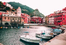 Famous view of the Vernazza old town Italy Cinque terre in the early morning sunrise view, colorful traditional building houses an stock image Famous view of the Vernazza old town Italy Cinque terre in the early morning sunrise view, colorful traditional building houses an stock image