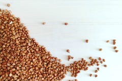 Farina di grano saraceno organica un fondo di legno bianco Ingrediente per la prima colazione sana fotografia stock libera da diritti Farina di grano saraceno organica un fondo di legno bianco Ingrediente per la prima colazione sana fotografia stock libera da diritti