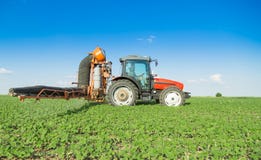 Farmer in tractor spraying soybeans stock image Farmer in tractor spraying soybeans stock image