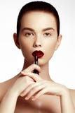 Fashion and beauty. Beautiful young woman with wine lipstick royalty free stock images Fashion and beauty. Beautiful young woman with wine lipstick royalty free stock images