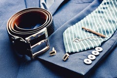 Fashion Clasic Men`s Suit With Black Leather Belt, Striped Blue Tie, Golden Ufflinks And Tie Clip. Business Men`s Royalty Free Stock Image Fashion Clasic Men`s Suit With Black Leather Belt, Striped Blue Tie, Golden Ufflinks And Tie Clip. Business Men`s Royalty Free Stock Image