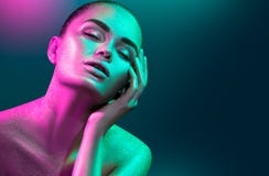 Fashion model woman in colorful bright sparkles and neon lights posing in studio, portrait of beautiful girl stock photos Fashion model woman in colorful bright sparkles and neon lights posing in studio, portrait of beautiful girl stock photos