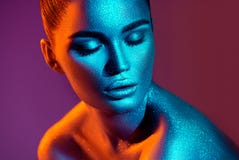 Fashion model woman in colorful bright sparkles and neon lights posing in studio, portrait of beautiful girl royalty free stock photography Fashion model woman in colorful bright sparkles and neon lights posing in studio, portrait of beautiful girl royalty free stock photography
