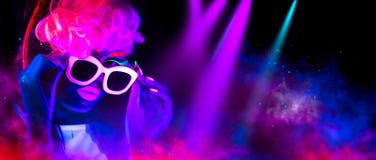 Fashion model woman in neon light. Portrait of beautiful model girl with colorful fluorescent makeup stock image Fashion model woman in neon light. Portrait of beautiful model girl with colorful fluorescent makeup stock image