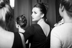 fashion models prepared for runway by stylish designer. Black and white photography