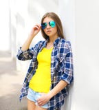 Fashion portrait young girl wearing a sunglasses and checkered shirt stock photo Fashion portrait young girl wearing a sunglasses and checkered shirt stock photo