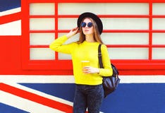 Fashion pretty woman holding cup over colorful urban stock images Fashion pretty woman holding cup over colorful urban stock images