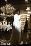 Fashion Show of Wedding dress and Evening Gown along Chandelier stock image Fashion Show of Wedding dress and Evening Gown along Chandelier stock image