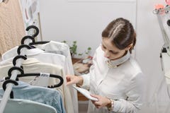 Fashion woman choosing a piece for the new collection with digit stock images Fashion woman choosing a piece for the new collection with digit stock images