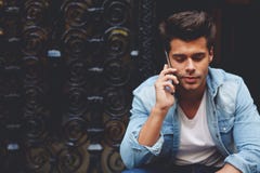 fashionable man using his mobile phone in urban setting royalty free stock photos fashionable man using his mobile phone in urban setting royalty free stock photos