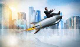 Fast internet concept with a businessman with laptop over a rocket royalty free stock photos Fast internet concept with a businessman with laptop over a rocket royalty free stock photos