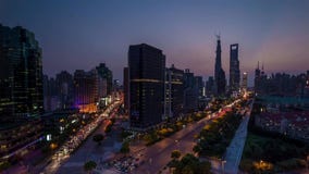 Fast moving car trail in city at night stock photo Fast moving car trail in city at night stock photo