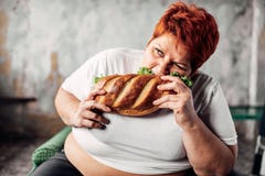 Fat woman eats sandwich, overweight and bulimic stock images Fat woman eats sandwich, overweight and bulimic stock images