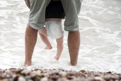 Father And Baby Sea Wading Stock Photography