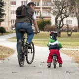 Father And Child Cycling Stock Images Father And Child Cycling Stock Images